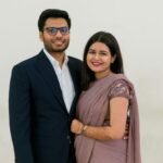 A Couple Smiling at the Camera